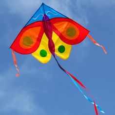 a colorful kite flying in the blue sky