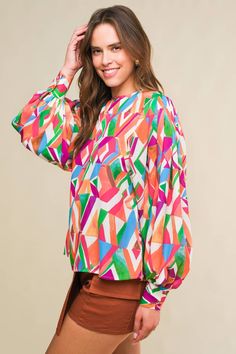 A printed woven top featuring round neckline, wide long sleeve with cuff and back neck button closure Details: Self : 100% Polyester Size & Fit - Model is 5`8" And Wearing Size Small- Measurements Taken From Size Small- Approx. Length: 24" Oversized Graphic Print Blouse For Fall, Oversized Fall Blouse With Graphic Print, Multicolor Lantern Sleeve Printed Blouse, Oversized All Over Print Tops For Spring, Oversized Tops With All Over Print For Spring, Oversized Spring Tops With All Over Print, Long Sleeve Tops With Abstract Print For Work, Chic Long Sleeve Blouse With Abstract Print, Multicolor Printed Lantern Sleeve Blouse