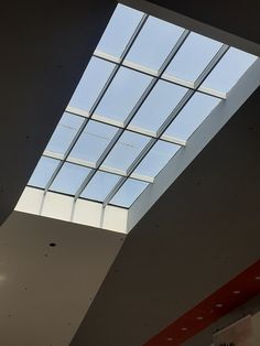 the skylight is shining brightly into the room