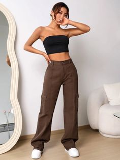 Elevate your denim game with our High Waist Cargo Jeans. These jeans feature a high waistline that flatters your figure and adds a trendy touch. With cargo-style pockets, they offer both style and functionality. Made from premium denim, these jeans provide comfort, durability, and a fashion-forward look. Perfect for adding an edgy twist to your casual outfits, our High Waist Cargo Jeans are a must-have in your wardrobe. Details: Color: Brown Pattern Type: Plain Type: Wide Leg Jeans Style: Cargo Trendy Brown High-waist Jeans, Trendy Brown High Waist Jeans, Trendy High Waist Brown Jeans, Trendy Straight Leg Non-stretch Cargo Jeans, Trendy Non-stretch Straight Leg Cargo Jeans, Baggy High Rise Cargo Jeans For Fall, Baggy Mid-rise Cargo Jeans For Fall, Fitted Cargo Style Utility Jeans, High Rise Brown Denim Flare Jeans