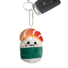 a keychain shaped like a sushi doll with a hat on it's head