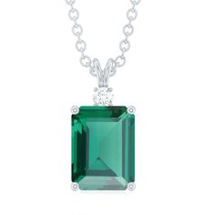 Product Details Prepare to be captivated by the mesmerizing solitaire pendant, showcasing a vibrant octagon-cut lab-created emerald as its centerpiece. The vivid green hue of the created emerald is further accentuated by the illuminating presence of a round moissanite at its base. Held securely with minimal prongs, the pendant is connected to an elegant and sturdy chain. Product Information SKU SHP-PENDANT112035339 Length 12.5 mm Width 6 mm Weight 4.10 gm (Approximate) LAB CREATED EMERALD INFORM Dazzling Emerald Cut Necklace With Prong Setting, Emerald Cut Moissanite Fine Jewelry Necklace, Emerald Cut Moissanite Necklace In Fine Jewelry Style, Emerald Cut Moissanite Necklaces Fine Jewelry, Gift Emerald Necklace With Brilliant And Emerald Cuts, Emerald Diamond Necklace With Brilliant Cut For Anniversary, Anniversary Emerald Diamond Necklace With Brilliant Cut, Emerald Cut Moissanite Necklace With Prong Setting, Anniversary Emerald Diamond Necklace In Brilliant Cut