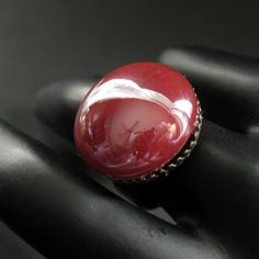 A richly colored dark red bit of rounded lampwork glass with a high gloss finish has been set upon a bronze tone adjustable ring base in this simple but elegant handmade ring design. Cabochon Size: approx. 18mm This handmade glass ring has an adjustable ring base that makes it comfortable to wear no matter the size of the wearer's fingers (size 7 and up) as well as ideal for switching from finger to finger as wanted. If you would like to order a larger quantity than what's offered in this listin Adjustable Oval Red Ruby Ring, Adjustable Red Oval Ruby Ring, Adjustable Vintage Ruby Ring, Vintage Adjustable Red Ruby Ring, Witch Rings, Red Ring, Easter Sale, Glass Ring, Bronze Ring