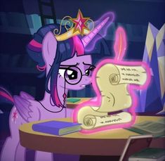 a pony with a crown sitting at a table