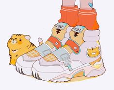 a pair of shoes with cartoon characters on them and a cat sitting next to it