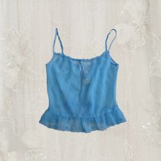 Vintage NWT La Senza Blue Floret Cami sheer material, adjustable straps. Has the cutest little floral embroidery details (swipe to see) size: S Blue Lace Cami Top, Blue Camisole Top With Lace Trim, Blue Lace Trim Spaghetti Strap Camisole, Blue Spaghetti Strap Tank Top With Lace Trim, Vintage Blue Sheer Sleepwear, Blue Cami, Sheer Material, Womens Blouses, Light Summer