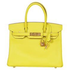 Discover the pinnacle of luxury with our Hermès Birkin 30, a stunning representation of exquisite craftsmanship and timeless style. This iconic handbag, crafted from the renowned Epsom leather, is known for its grainy texture that not only enhances its aesthetic appeal but also ensures durability and scratch resistance. The vibrant lime shade infuses a lively yet elegant charm, making it a standout accessory for any occasion. The Hermès Birkin is not just a bag; it's an investment in unparalleled craftsmanship and enduring style. Ideal for the discerning fashion enthusiast who appreciates luxury that stands out. Stamp: Z - 2021 Gold Hardware Lime / Yellow Colour Height: 23cm Width: 30cm Depth: 15.5cm Come with: Box, Dust Bag, Felt, Lock and Key Grainy Texture, Birkin 30, Hermes Birkin 30, Jane Birkin, Charm Making, Handle Bag, Hermes Birkin, Fashion Handbags, Timeless Style