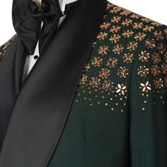 Package Includes: 1 x Jacket - 1 x Pant

Introducing the custom green tuxedo with stone embroidery, crafted from luxurious 120s fabric with a silk lining. This all-season tuxedo features a double-breasted jacket with a shawl lapel, three straight pockets, and stunning stone embroidery on the shoulders. The flat-front trousers include two back pockets and a zip closure, ensuring style and functionality. Perfect for any formal occasion, this tuxedo combines elegance and impeccable craftsmanship.

 	Fabric: 120s 
 	Lining Fabric: Silk
 	Pattern: Plain
 	Buttons: Fabric
 	Construction: Half Canvas
 	Seasonality: All Season
 	Jacket: Shawl Lapel, 3 Straight Pockets, Stone Embroidery on Shoulder, Double Breasted
 	Trouser: Flat front, 2 Back Pockets, Zip Closure Mens Suits Green, Jodhpuri Suits For Men Wedding, Formal Work Wear, Suit For Men Wedding, Gold Tuxedo, Jodhpuri Suits For Men, Green Jacket Men, Stone Embroidery, Green Tuxedo