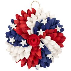 a red, white and blue wreath with stars on it is hanging from a rope