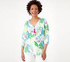 From sandy shores to patio parties, this TripleLuxe half-zip top delivers tropical vibes for any social occasion thanks to a cheerful hibiscus print and charming tassel. From Belle by Kim Gravel. Casual Summer T-shirt With Hibiscus Print, Casual Short Sleeve T-shirt With Hibiscus Print, Summer T-shirt With Hibiscus Print And Short Sleeves, White Hibiscus Print Casual T-shirt, Summer Cotton T-shirt With Hibiscus Print, Hibiscus Print, Kim Gravel, Half Zip Top, Patio Party