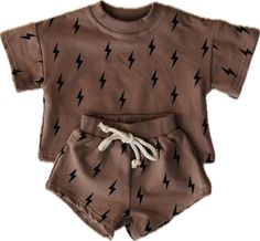 Lightning bolt short set features a brown background and a black lightning bolt. This set... Brown Cotton Playwear Set, Casual Brown Playwear Sets, Baby Luna, French Baby, Diaper Bag Accessories, Baby Layette, Baby Co, Black Lightning, Big Gifts