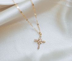 ∙ ∙ S P A R K L I N G ∙ C R O S S ∙ N E C K L A C E ∙ ∙ Made with the following: Gold Plated Cross 23mm x 9mm 14K Gold Filled Findings  14K Gold Filled Spring Clasp 14K Gold Filled Chain This listing is for one necklace. The third picture shows the necklace paired with the Mini Paperclip Necklace https://www.etsy.com/listing/985278174/ and the Sweet to the Soul Necklace https://www.etsy.com/listing/766035933/ (sold separately). ∙ ∙ H O W ∙ T O ∙ O R D E R ∙ ∙ Please select the chain and length f Christian Necklace For Women, Dainty Pendant Cross Necklace For Gift, Dainty Cross Pendant Necklace For Gift, Dainty Cross Pendant Necklace As Gift, Dainty Pendant Cross Necklace, Delicate Cross Pendant Necklace For Gift, Delicate Cross Necklace For Gift, Delicate Cross Necklace Perfect As A Gift, Gift Cross Pendant Necklace With Clavicle Chain