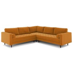 an orange sectional couch sitting on top of a white floor