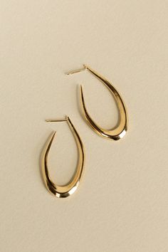 Organically slumped hoops with angular walls and a subtle taper. Inspired by ancient Phoenician gold earrings from 7th-6th century BCE. Solid cast in recycled brass, sterling silver with an option of gold vermeil finish, or 14k yellow gold. Sterling posts on brass and sterling styles. Last photo shows all three Villa sizes for reference. Approximately 1.75" long 14k gold Villa Hoops are made to order and will take 3-4 weeks for delivery Ancient Designs, Hoops Earrings, Jewelry Fashion Trends, Gold Vermeil, Everyday Essentials Products, Gold Earrings, Hoop Earrings, Fashion Jewelry, Villa