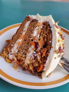 a slice of carrot cake on a plate with a fork