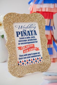 a photo frame with the words wedding written on it and some confetti sticks