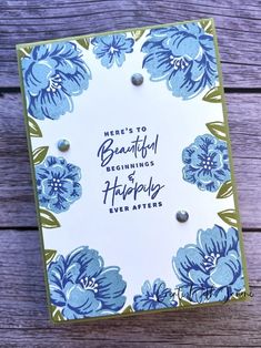 a card with blue flowers on it that says, here's to beautiful beginnings happily ever after