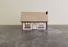 Original design by Miniature Crush, laser cut 1:144 scale kit A dollhouse for your dolls house Comes unassembled, includes complete instructions with color photos Finished house measures 2 7/8" wide x 1 1/2" deep x 2" tall (7.3 cm x 3.8 cm x 5.2 cm) Kit House, Island Crafts, Mini Doll House, Dining Room Accessories, Battery Operated Lights, Exclusive Furniture, Paving Stones, Kit Homes