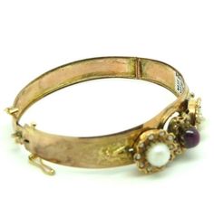 Antique bracelet, dating back to the mid-1800s, with cabochon of central natural ruby and natural pearls, in 9-carat solid gold (professionally tested). A small piece of gold is missing alongside one of the two pearls, however almost invisible. Weight 11.15 grams, size of the inner oval of the bracelet 5.6 x 4.8 centimeters, size per wrist for women of medium-small size. Corresponding to a length of about 17 centimeters. If once you buy you find that not your size can be returned for free. Sold 1950s Ring, Antique Bracelets, Vintage Jewelry Box, Natural Ruby, Natural Emerald, Vintage Italian, Natural Pearls, Beautiful Rings, Natural Diamonds