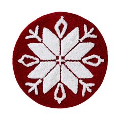 a red and white snowflake on a white background