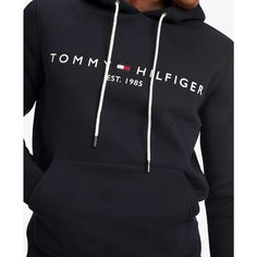 Stay comfortable and stylish with Tommy Hilfiger's Embroidered Logo Hoodie. Made with cotton, this fleece hoodie is designed for total comfort. Featuring the iconic Hilfiger signature logo and a convenient kangaroo pocket, this hoodie is the perfect addition to your wardrobe..Regular Fit: Tommy Hilfiger's Classic Pullover Hoodie made to fit comfortably..Size Medium Chest measures 44-1/2'.Model is wearing a size Medium.Drawstring hoodie for adjustable hood.Kangaroo pocket for added convenience.Cl Tommy Hilfiger Outfit, Drawstring Hoodie, Tommy Hilfiger Man, Signature Logo, Hoodie Top, Fleece Hoodie, Kangaroo Pocket, Kangaroo, Men's Clothing