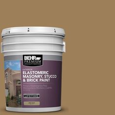 a bucket of paint with the words behr premium on it and an image of a house in the background