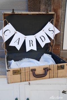 an open suitcase with some cards hanging from it's handles and the words cards are free printable bunting flags and tutor