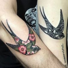 two people with matching tattoos on their arms, one has a bird and the other has flowers