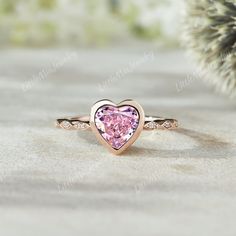 Unique Pink Sapphire Engagement Ring Rose Gold Heart Shaped Sapphire Wedding Ring Anniversary Promise Ring Valentines Day Gift For Her  ◆RING DETAILS: ❃Engagement ring: Centre Stone: Stone: Lab pink sapphire Shape: Heart cut  Size: 7mm Side stone: Round cut: Moissanite Weight: 0.024ct Clarity - SI-VS Color- G-H ❃Band Width:1.5mm ◆All ring sizes are available, If you can't find your ring size in the list, please feel free to contact me. ◆Metal Options. Available in Sterling silver and 10k/14k/18k yellow gold, white gold, and rose gold.  ◆Other metals and stones are also available, please feel free to contact me. ◆Production & Shipping: It usually takes 2-3 weeks to make and 3-6 days to ship if you are in US. If you would like to receive your ring by the specified date, please contact me!  A Pink Sapphire Engagement Ring Rose Gold, Sapphire Engagement Ring Rose Gold, Pink Sapphire Engagement Ring, Sapphire Wedding Ring, Pink Sapphire Ring Engagement, Sapphire Wedding Rings, Engagement Ring Rose Gold, Sapphire Wedding, Rose Gold Heart