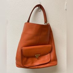 Nwt Banana Republic Orange Ebbed Leather Hobo Shoulder Bag. Front Exterior Fastened Picket With Gold Hardware. Interior Has Two Open Pouches And One Wid Zippered Pocket. Lining Is Burgundy. 13x12.5x6 Chic Orange Bucket Bag For Everyday Use, Chic Orange Bucket Bag For Travel, Casual Hobo Bag With Detachable Handle For Errands, Orange Bucket Bag For Everyday Use, Orange Satchel Bucket Bag For Daily Use, Versatile Hobo Bag With Detachable Strap For Errands, Orange Hobo Shoulder Bag, Orange Bag With Removable Pouch For Errands, Orange Crossbody Bucket Bag For Everyday Use