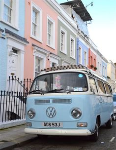 an old vw bus is parked on the street