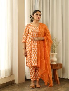 Beautiful handcrafted straight kurta pants set in pure cotton with lovely matching cotton doriya dupatta that is rightly finished with mirror embroidery. Color: Orange Fabric: Cotton and Kota Doria Note: Length and sizes can be customised Length - Kurta 40 inches Pants 38 inches Available in other colors If you happen to see some deformity in hand-work or fabric, that’s mere the technique of the same and not a defect. The garment is quite premium. The product will be delivered within 20-25 days Designer Cotton Unstitched Suit With Straight Kurta, Designer Cotton Palazzo Set With Dabka Work, Unstitched Kurta Suit With Mirror Work, Cotton Unstitched Suit With Dabka Work, Designer Cotton Kurta With Dupatta, Traditional Cambric Sets With Mirror Work, Designer Unstitched Cotton Salwar Kameez, Unstitched Cotton Suit With Mirror Work, Cotton Palazzo Set With Dupatta