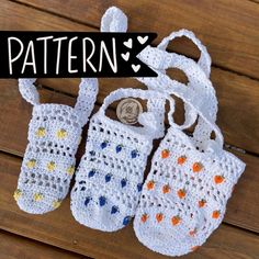 three crocheted purses sitting on top of a wooden table