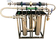 an industrial water filtrator is shown with pipes and valves attached to the tank