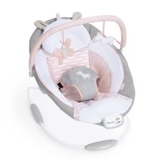 a baby's car seat that is in the shape of a rocking horse with pink and white accents