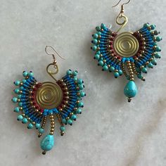 Boho Dangle Earrings. High-Quality Pure Copper And Turquoise, Blue And Red Wax Rope Materials. It Measures 2.2*1.8 Inches, And Weighs 0.01 Pounds. Blue Beaded Earrings For Festival With Ear Wire, Blue Beaded Festival Earrings With Ear Wire, Blue Earrings With Ear Wire For Festival, Blue Wire Wrapped Earrings For Festival, Unique Blue Beaded Earrings For Festivals, Zara Dangle Earrings With Matching Set, Zara Dangle Earrings Jewelry Set, Bohemian Turquoise Hoop Earrings With Colorful Beads, Handwoven Turquoise Bohemian Earrings