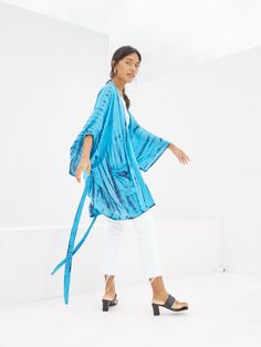 You’ll find the styling options are limitless with the chic Yoda - Tie Dye Wrap Kimono. This beautiful piece makes for the ideal lightweight layer or finishing touch to tie any look together. The bold tie-dye print easily adds a pop of color to any outfit. Features: Lightweight feel Very comfortable Breathable Tie-dye pattern Short sleeves Handcrafted One size -oversize all fit Removable waist tie closure/belt with loops Side slits at hem Two pockets Size + Fit Our model is 165cm/5’5 tall, small Casual Tie-dye Kimono For Spring, Casual Tie Dye Kimono For Spring, Blue Casual Wrap Outerwear, Casual Blue Wrap Outerwear, Blue Spring Kimono With Tie Waist, Spring Blue Kimono With Tie Waist, Blue Tie Waist Kimono For Spring, Summer Blue Relaxed Fit Outerwear, Blue Relaxed Fit Summer Outerwear