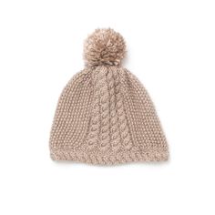 a knitted hat with a pom - pom on the top and side