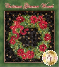 a christmas wreath with poins and ribbons on it is featured in the quilt pattern