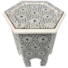 a white and black table with an intricate design