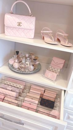 a white shelf filled with lots of pink items