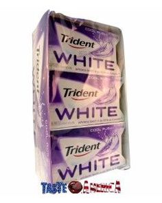 three packs of white toothpaste sitting on top of each other