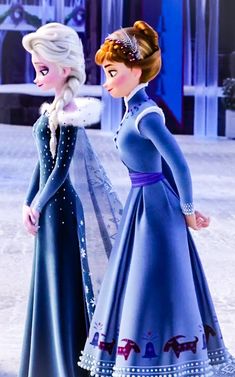 two frozen princesses standing next to each other