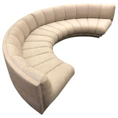 the curved couch is made out of fabric