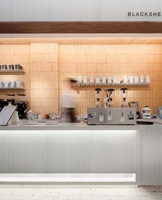 a restaurant kitchen with white counters and counter tops