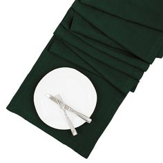 there is a plate and silverware on the napkins that are folded over it