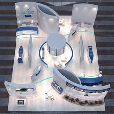 an aerial view of a futuristic office with blue and white furniture in the middle of it