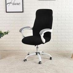 an office chair sitting on top of a carpeted floor next to a potted plant