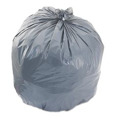 a large gray trash bag sitting on top of a white floor