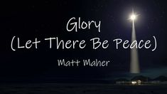 the words glory let there be peace written in front of a light pole at night